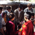 Anil distributing stationery with Jimit - 2