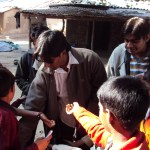 Anil distributing stationery with Jimit